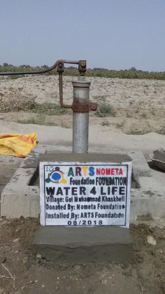 Another Mirpur Khas hand pump with its project sign
