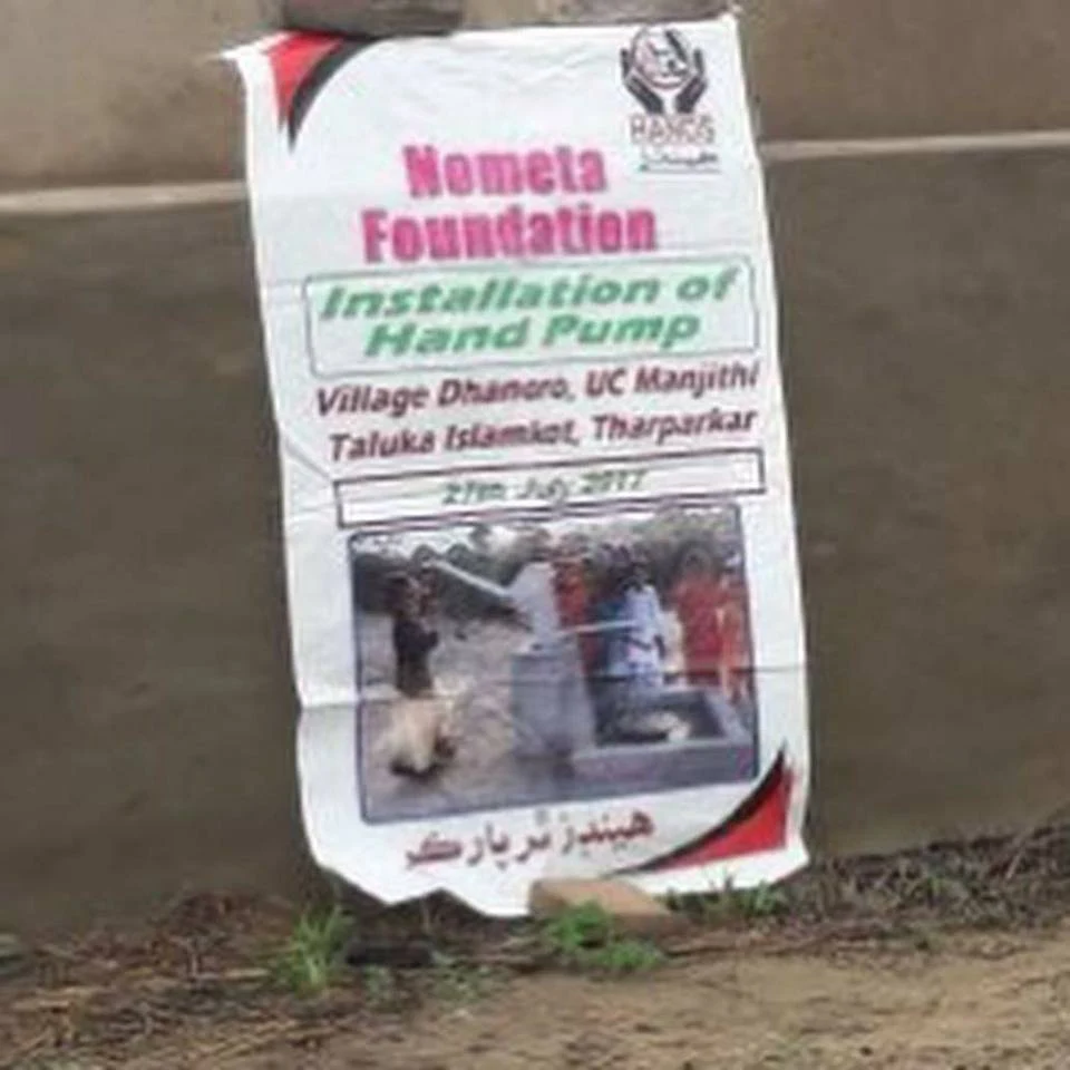 Nometa Foundation and HANDS banner for the hand-pump installation in Taluka Islamkot, Tharparkar